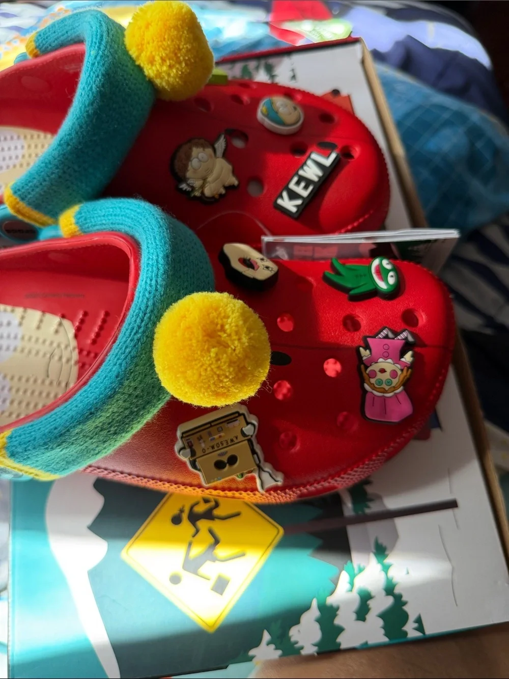 CROCS Kids Red Clog with Brown Sole and Teal Strap Accents